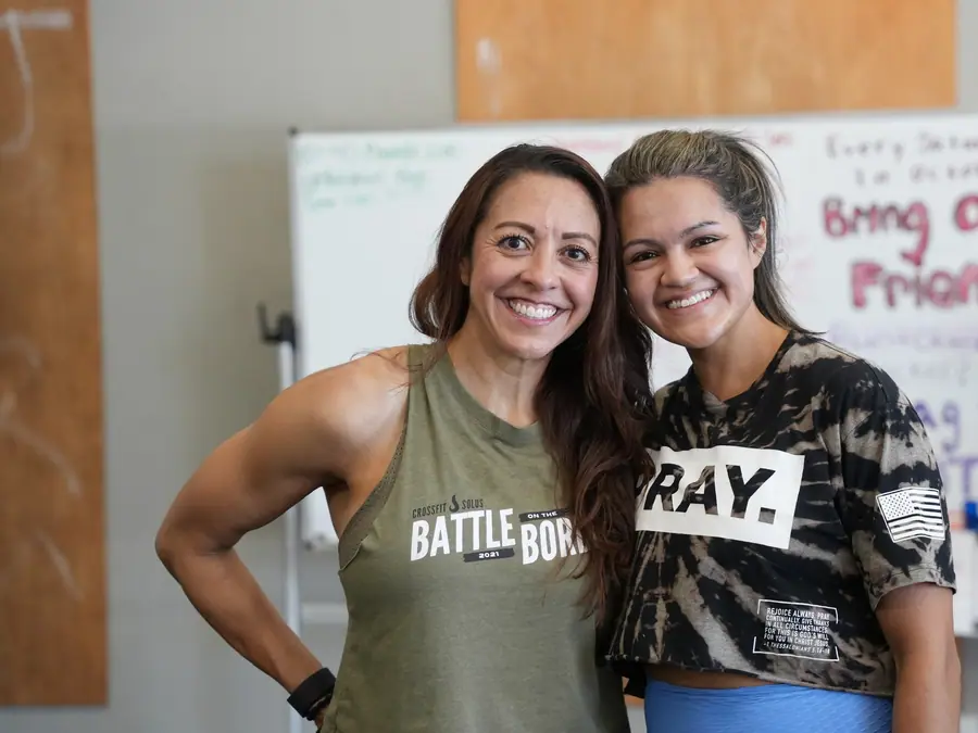 Two CrossFit OTL members smiling after class