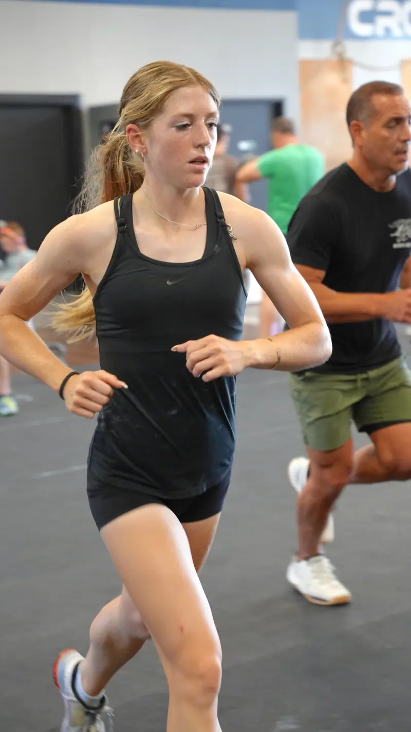 A CrossFit OTL member running during a morning class