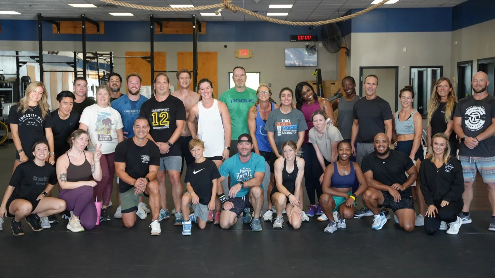 A big group of CrossFit OTL members and coaches together on the gym floor
